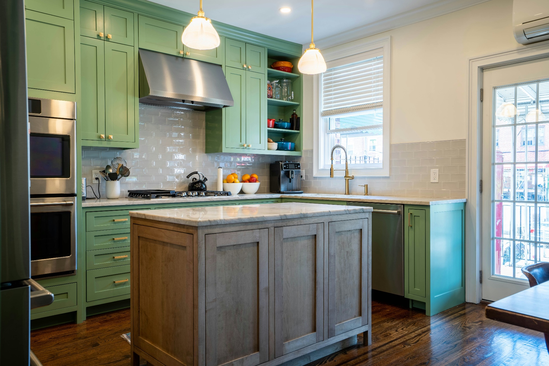 Bright green shaker kitchen with a weathered oak island, refinished by RMK Contractors